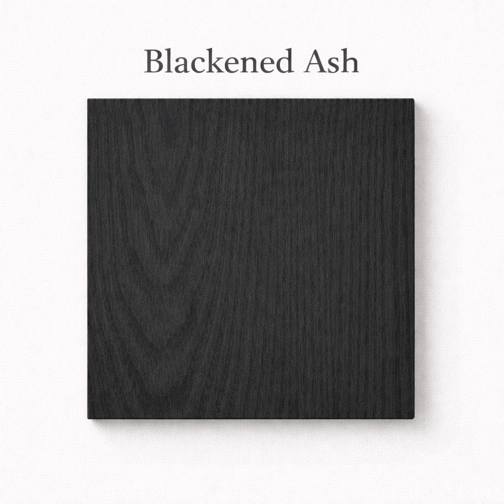 Blackened Ash wood sample on a white background with text above.