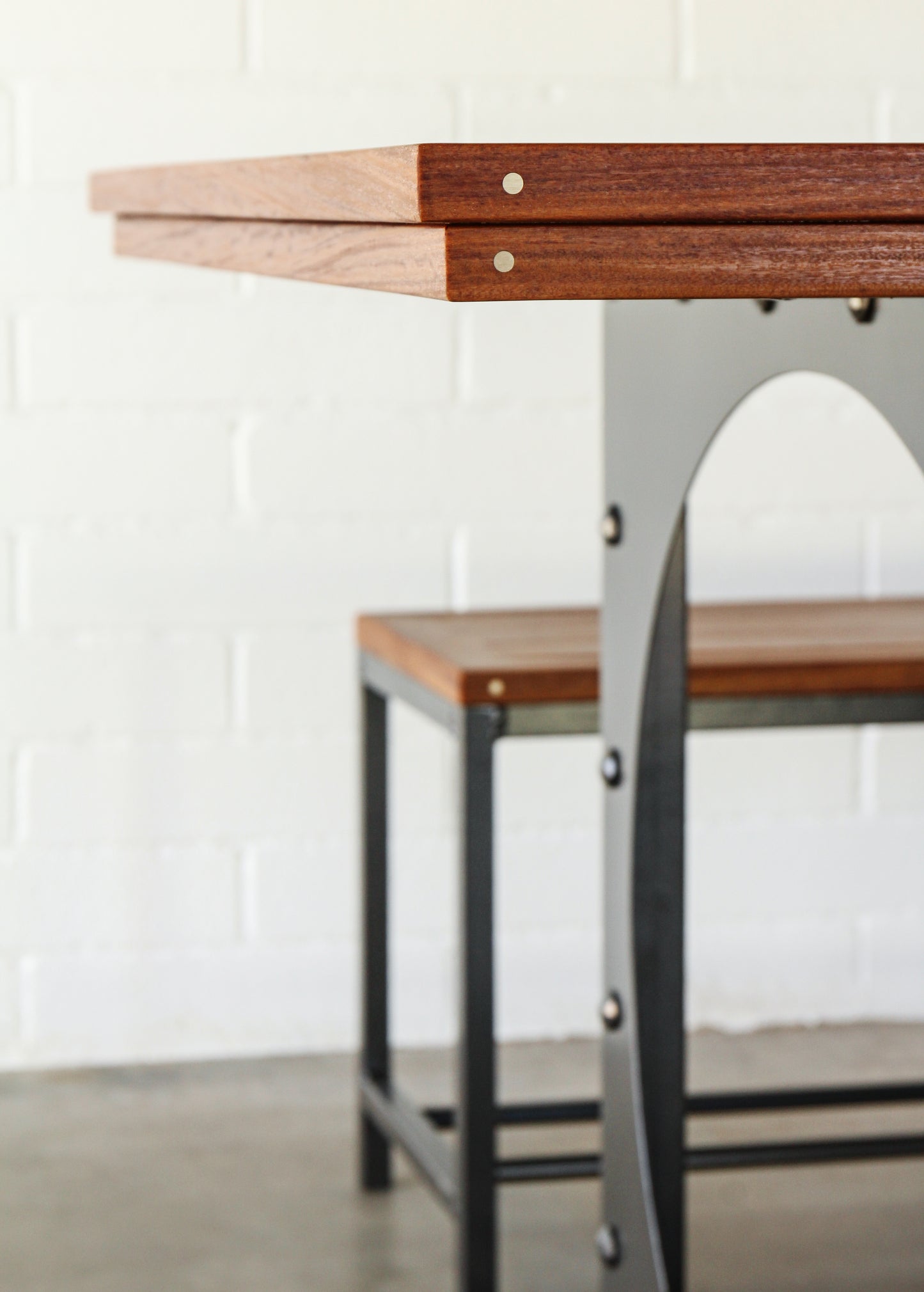 Outdoor dining table set-Table including two benches. Metal base, cumaru top, brass inlays.