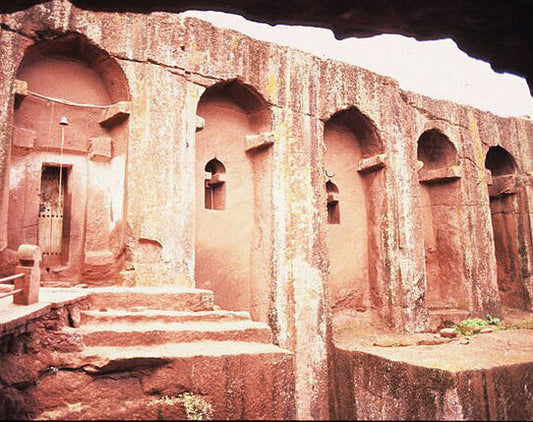 Ancient rock-hewn Lalibela church that inspired the Coptic cross and monolithic forms of our accent table