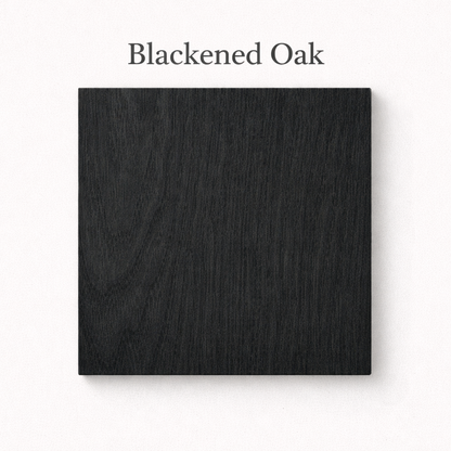 Square swatch of blackened oak wood on a white background with 'Blackened Oak' text.