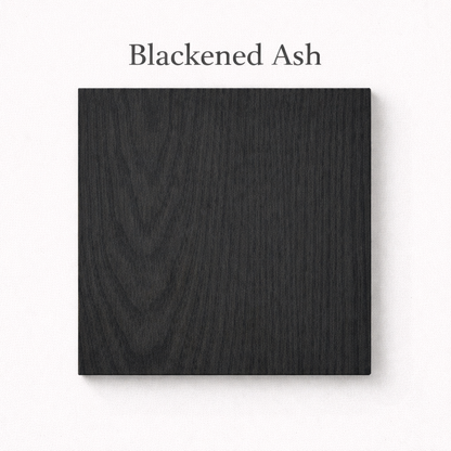 Blackened Ash wood sample on a white background with text above.