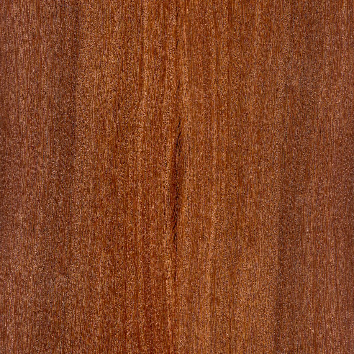 Close-up of a wooden surface with a rich brown color and visible grain pattern.