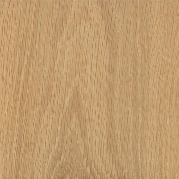 Close-up of a wooden surface with a light brown color and visible grain pattern.