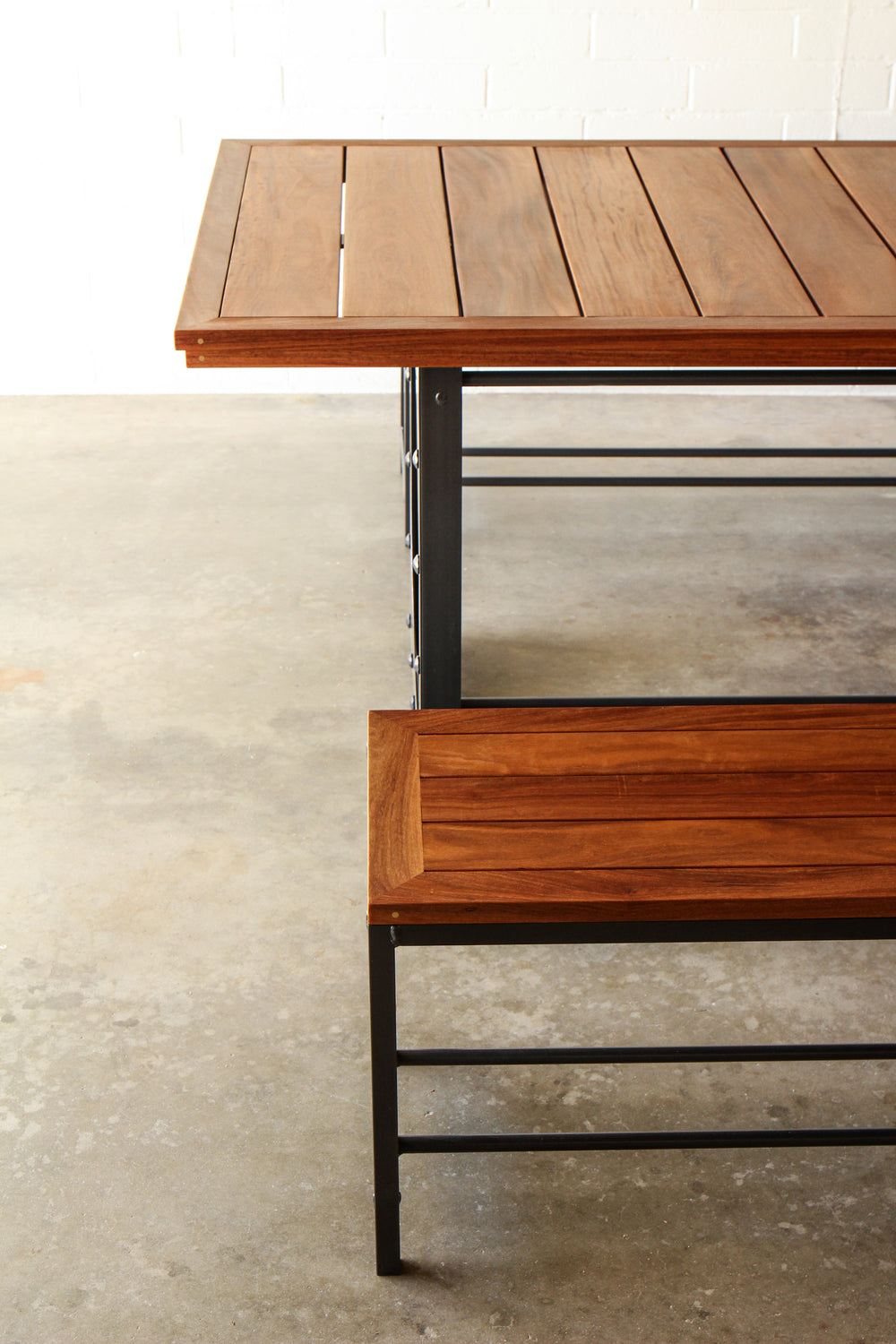 Outdoor dining table set-Table including two benches.  Metal base, cumaru top, brass inlays. 