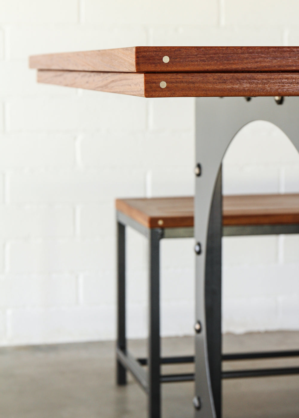 Outdoor dining table set-Table including two benches.  Metal base, cumaru top, brass inlays. 